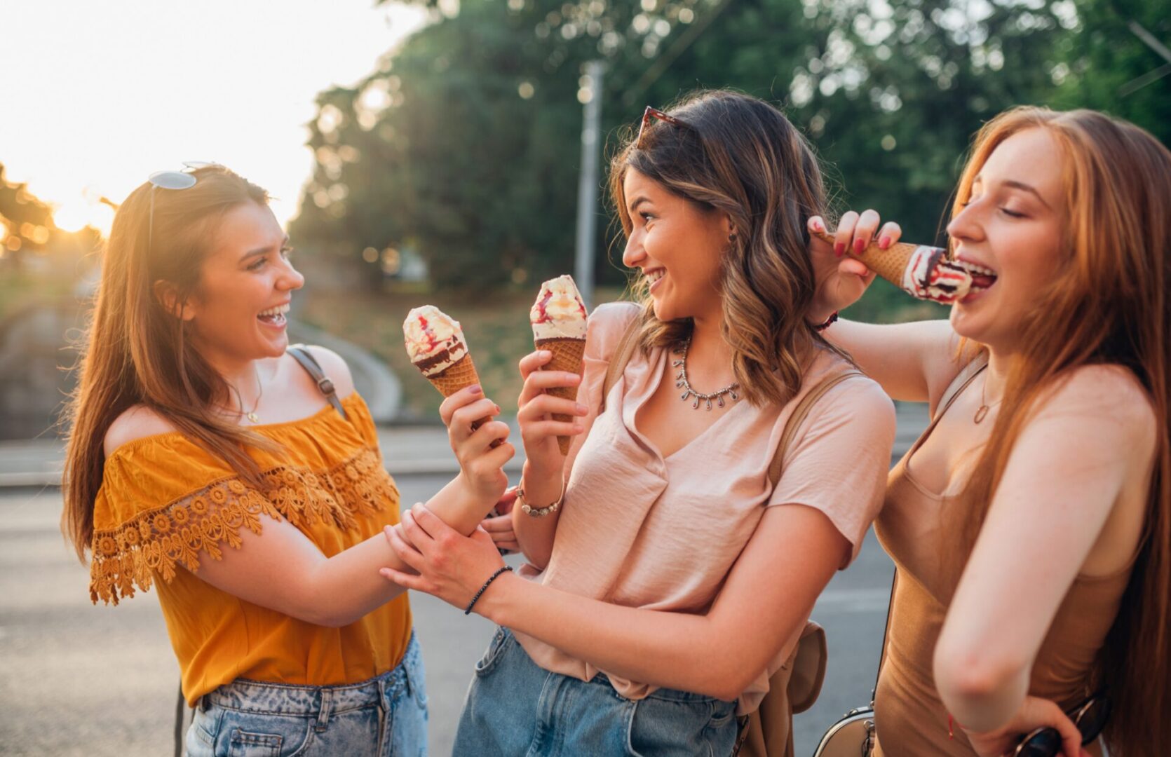 Happy girls eating ice cream after teeth sensitivity treatment at Lake Elsinore in Prestige Dental Spa
